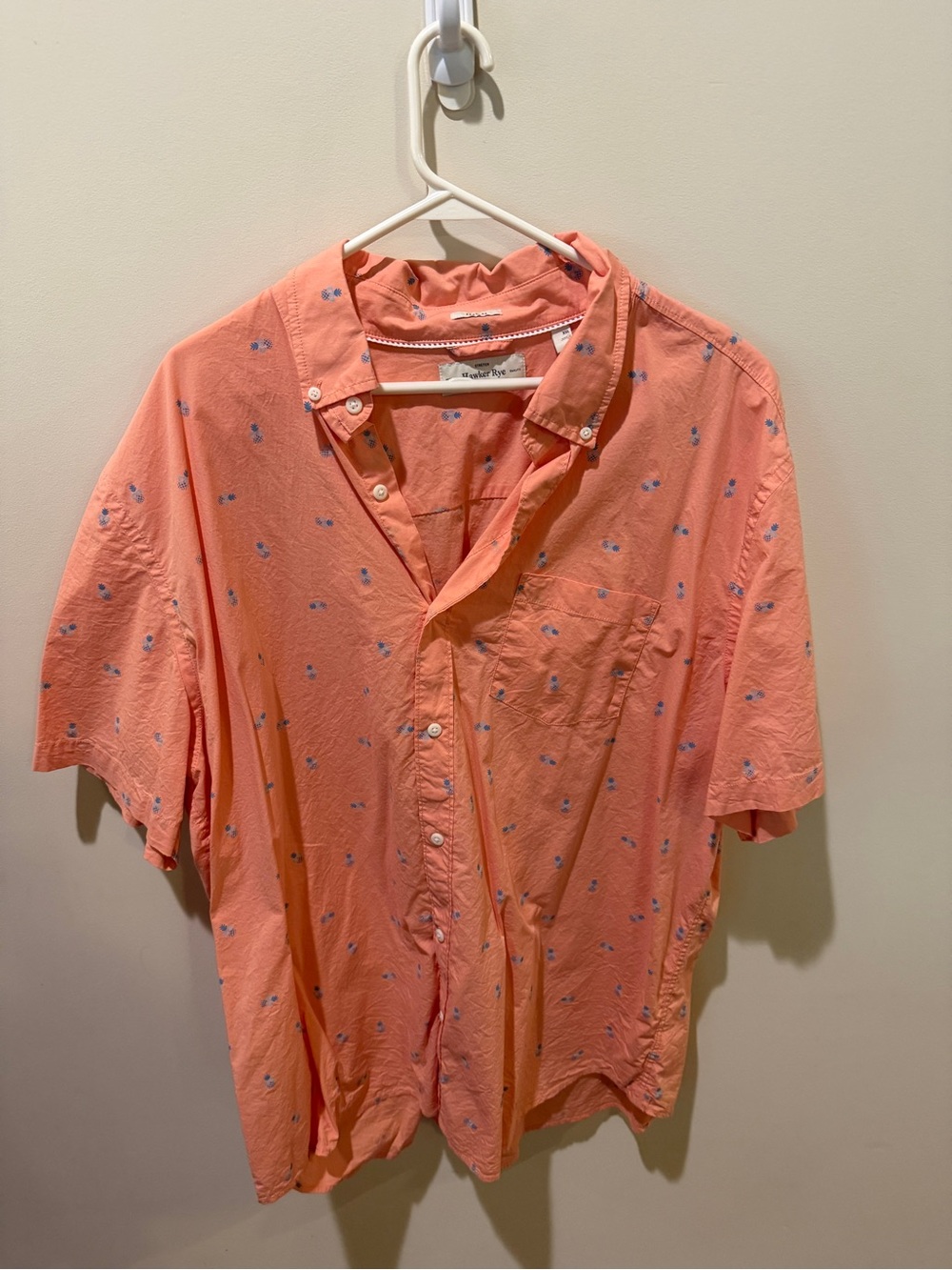 Men's Peach Short-Sleeve Button-Down Shirt with Subtle Blue Motif